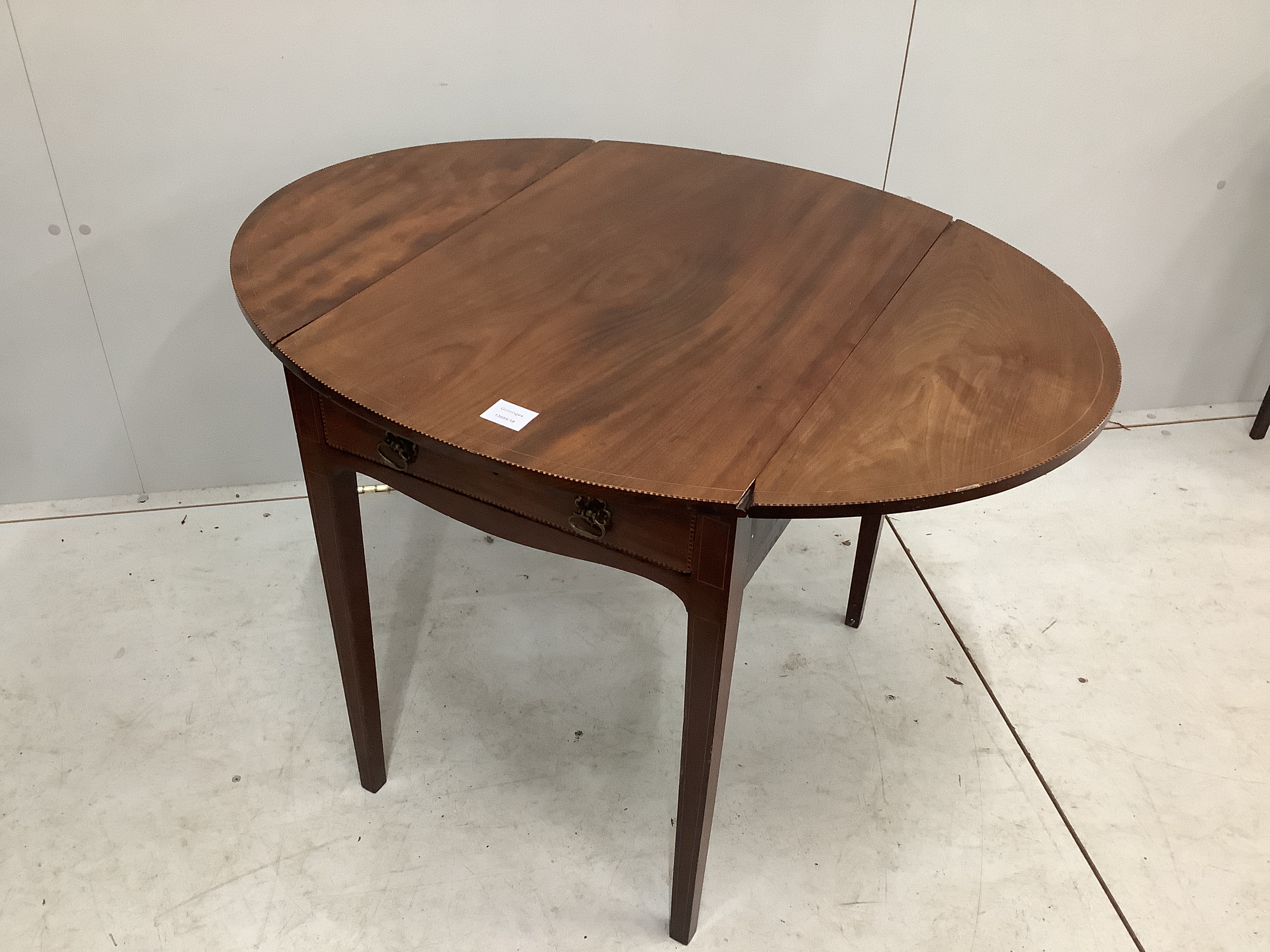 A small George III inlaid mahogany oval Pembroke table, width 71cm, depth 49cm, height 66cm